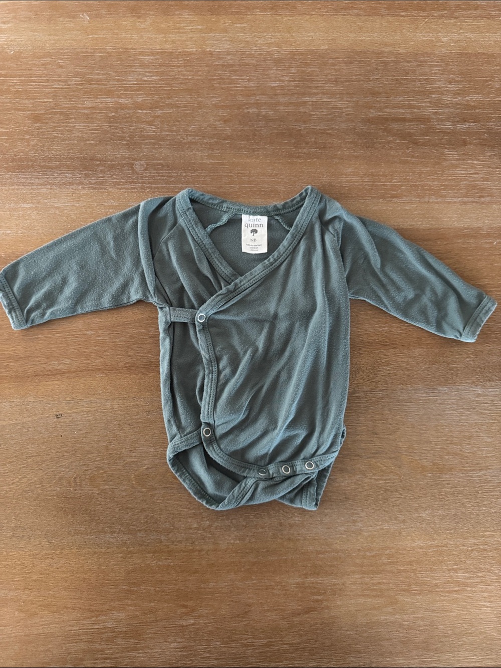 kate quinn muted sage green wrap one-piece bodysuit